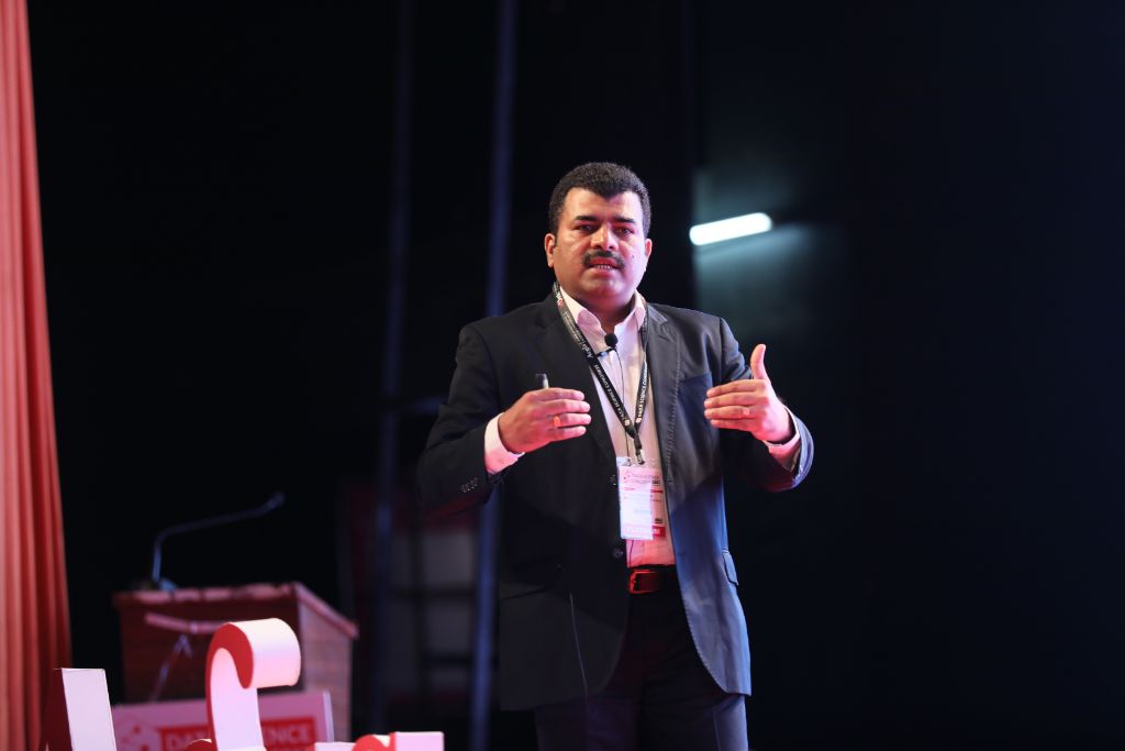 Speaker sharing insights from the podium